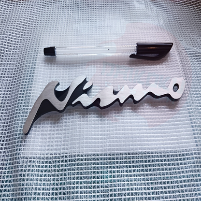 Emblema Adhesivo Nismo Gris Pro H34-51